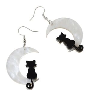 BLACK CAT SITTING ON HALF MOON PIERCED EARRINGS.